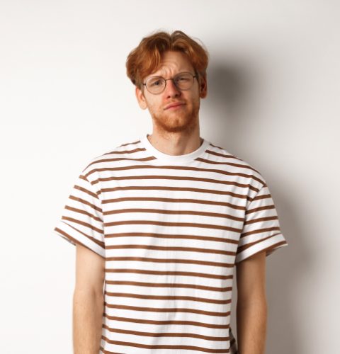reluctant-and-unamused-redhead-young-man-staring-a-2ZK43U3.jpg reluctant-and-unamused-redhead-young-man-staring-a-2ZK43U3.jpg